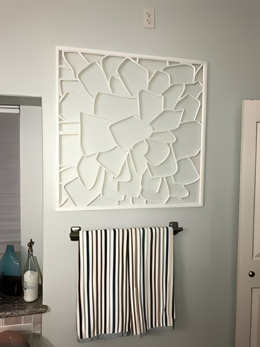 White artwork on bathroom wall