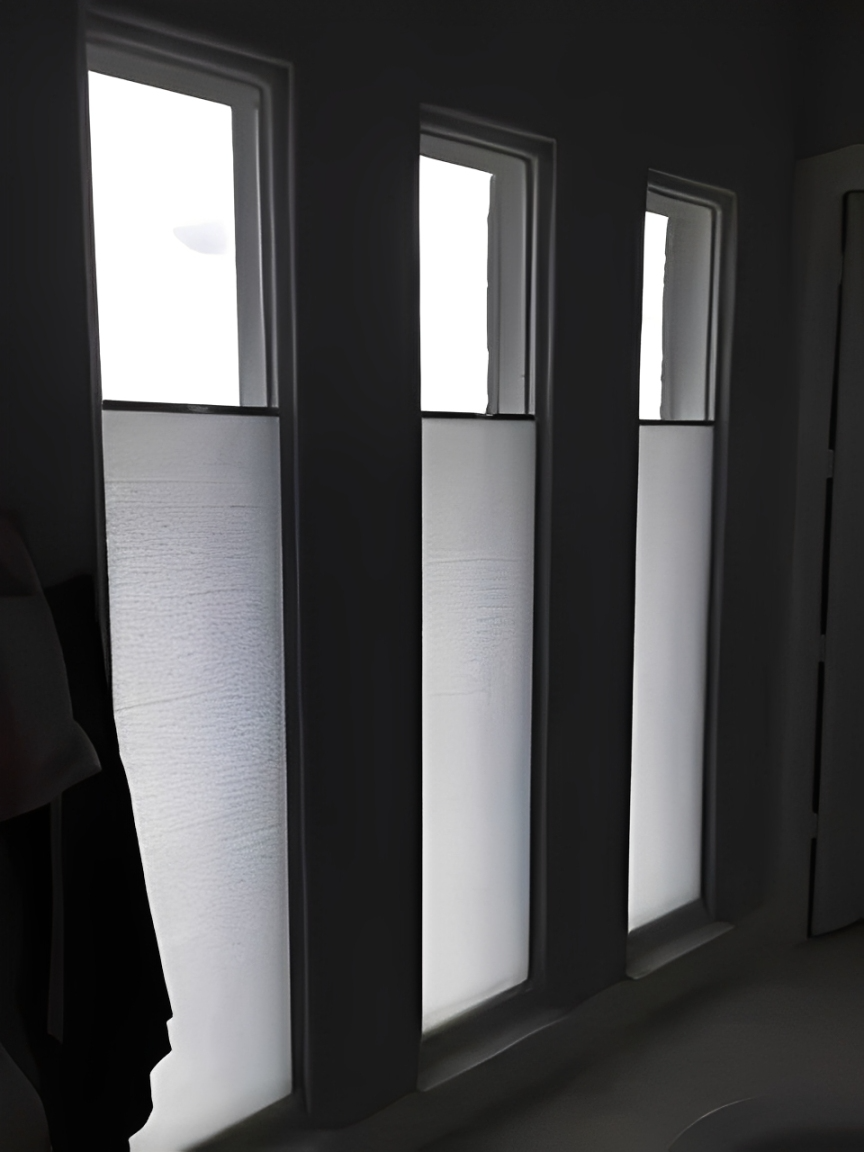 Three tall windows with diffused light
