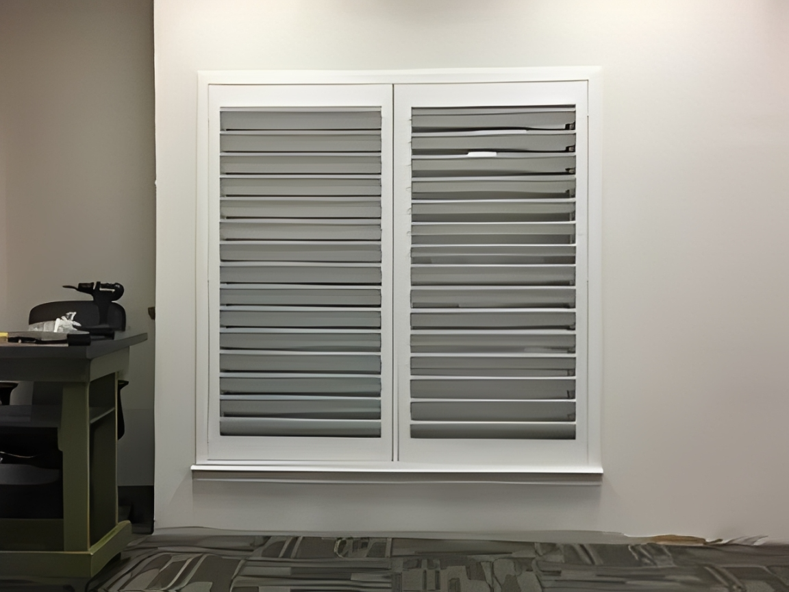 White louvered window shutters