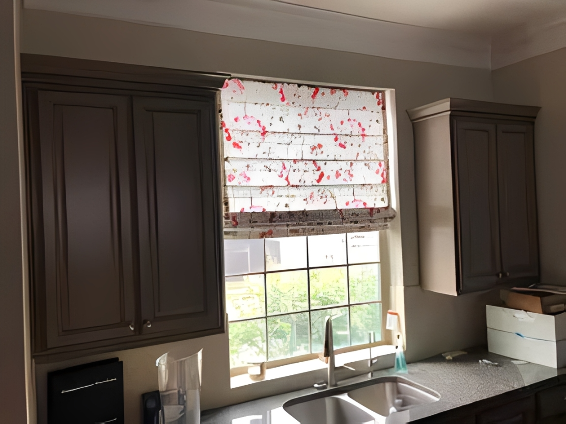 Kitchen window with floral blinds