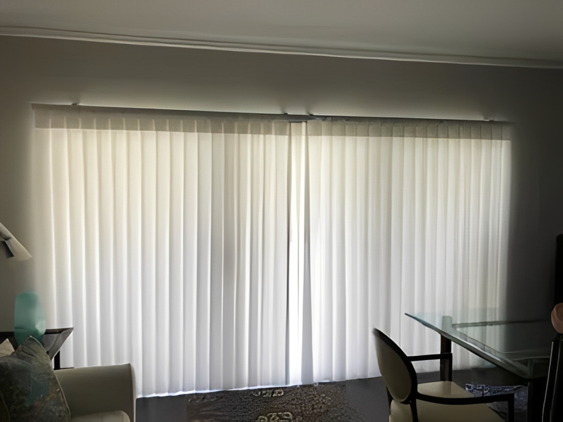 Bright living room with vertical blinds