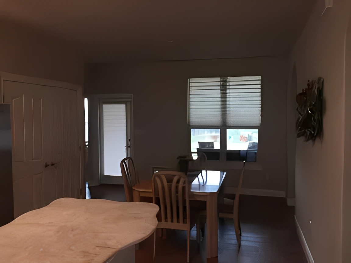 Dining room with wooden chairs and table