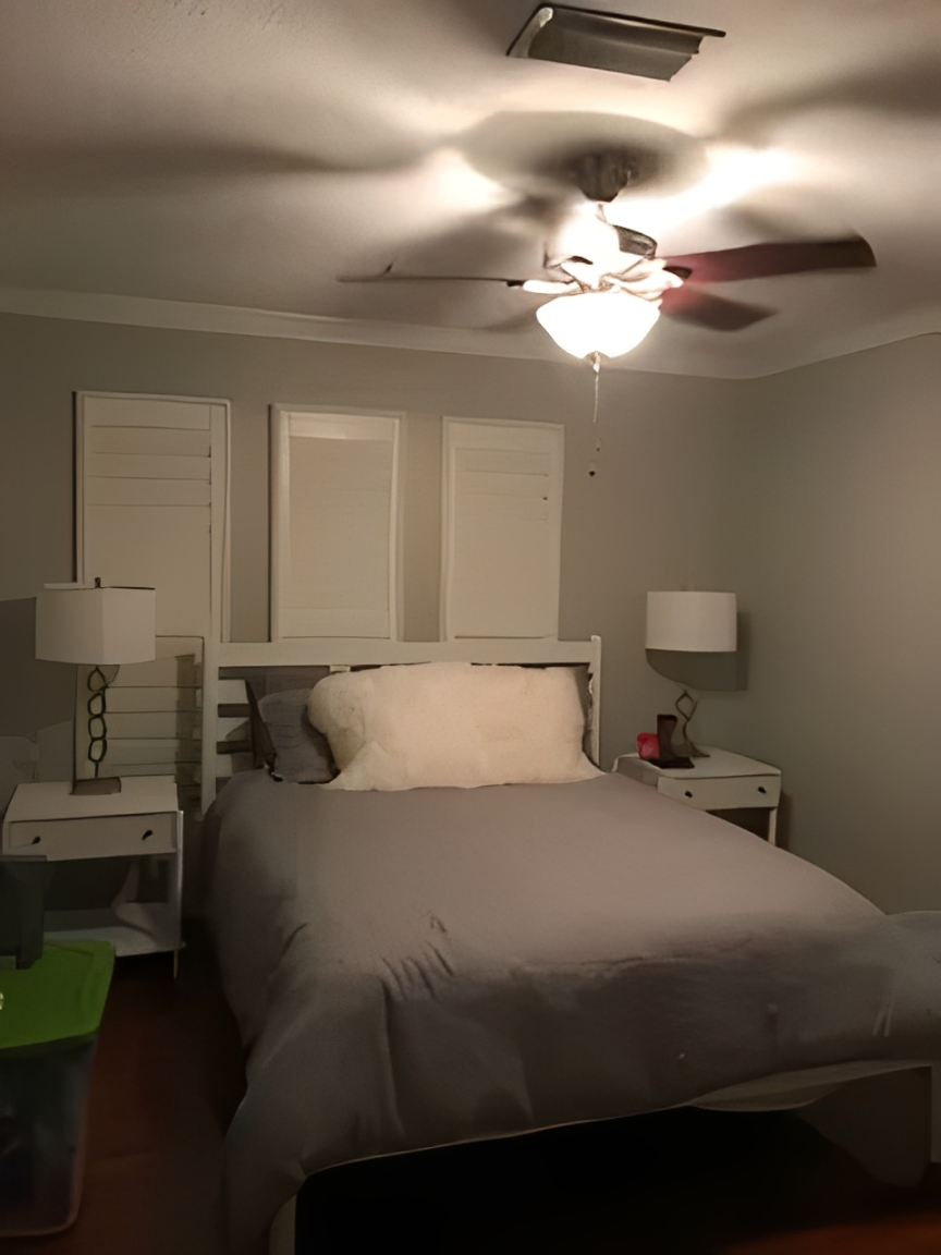 Cozy bedroom featuring white bed and lamps.
