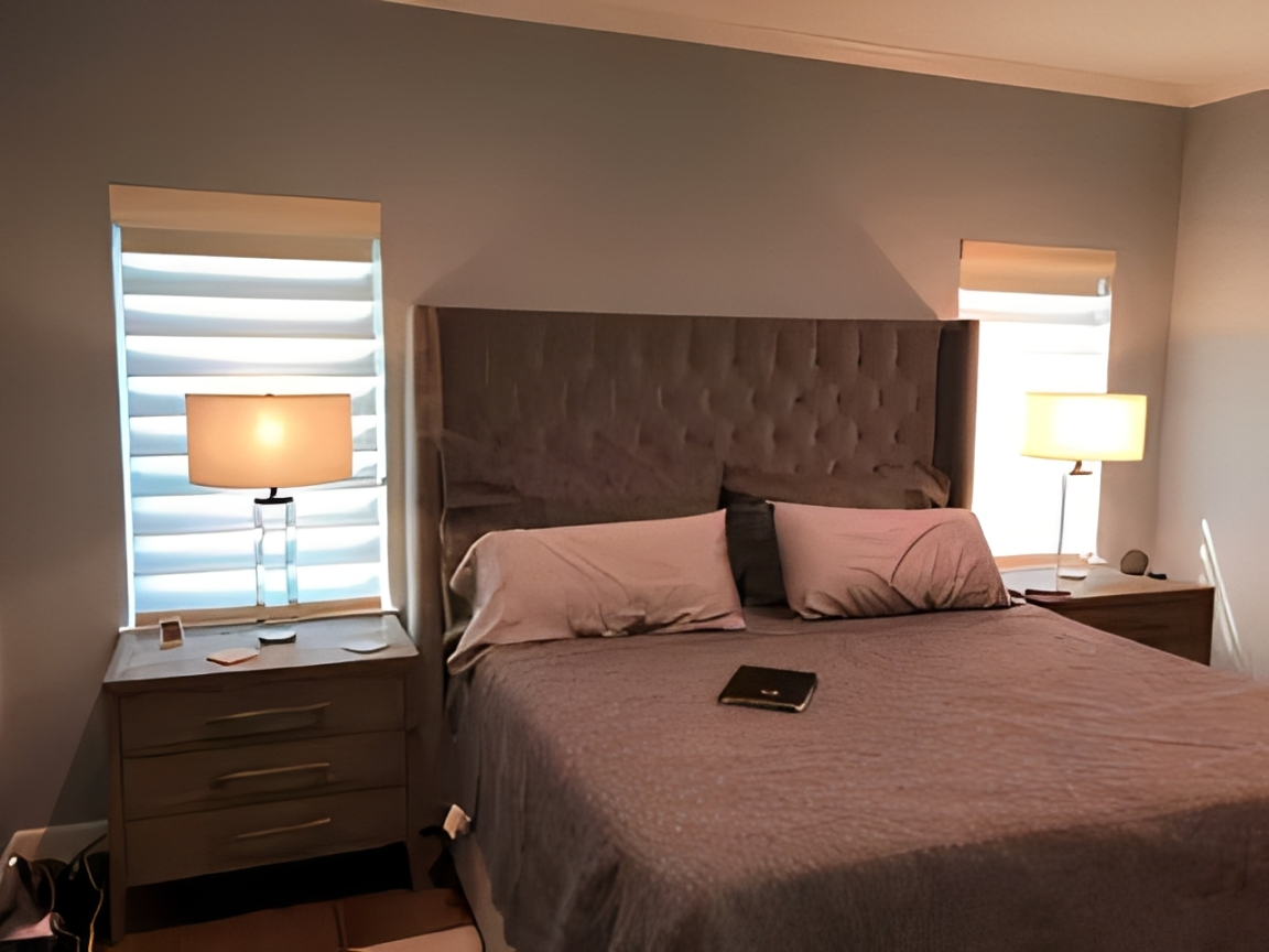 Elegant bedroom featuring gray bedding