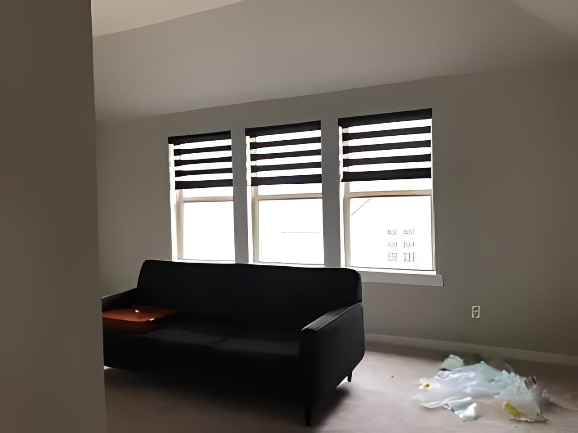 Three windows with striped blinds