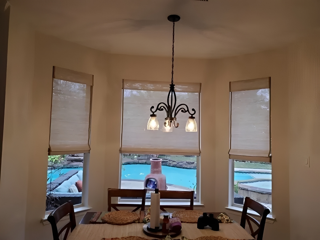 Table and chairs by windows