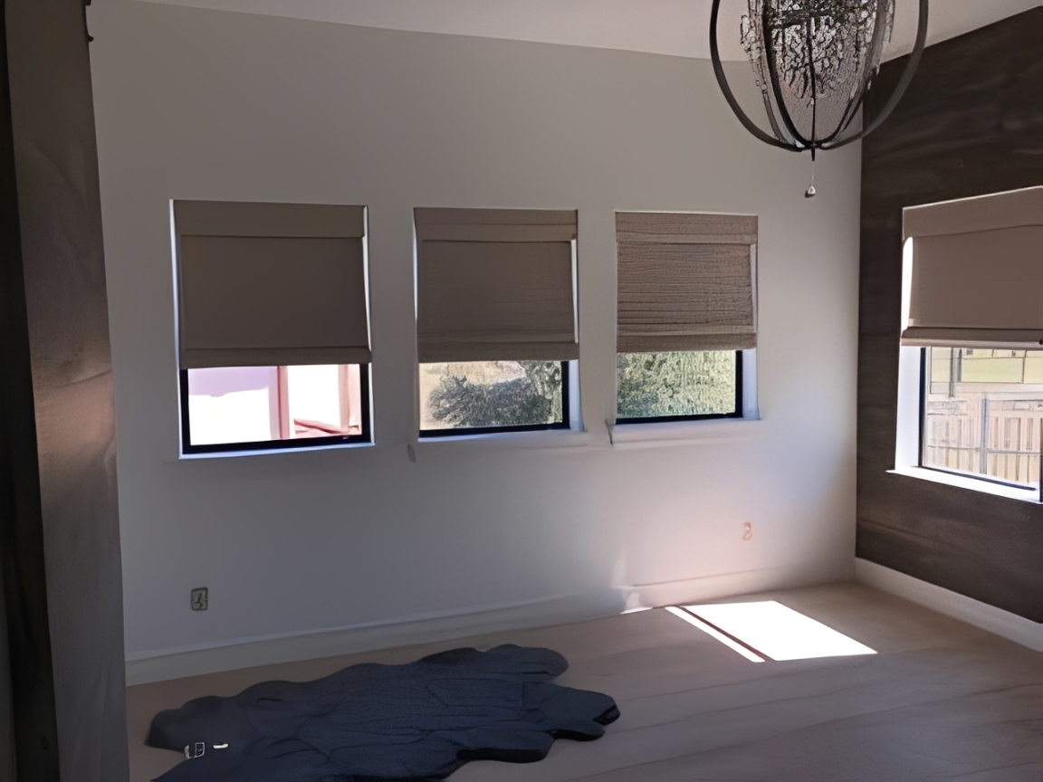 Sunlit room featuring wooden floor
