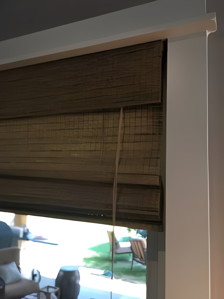 Indoor view with rolled-up wooden blinds