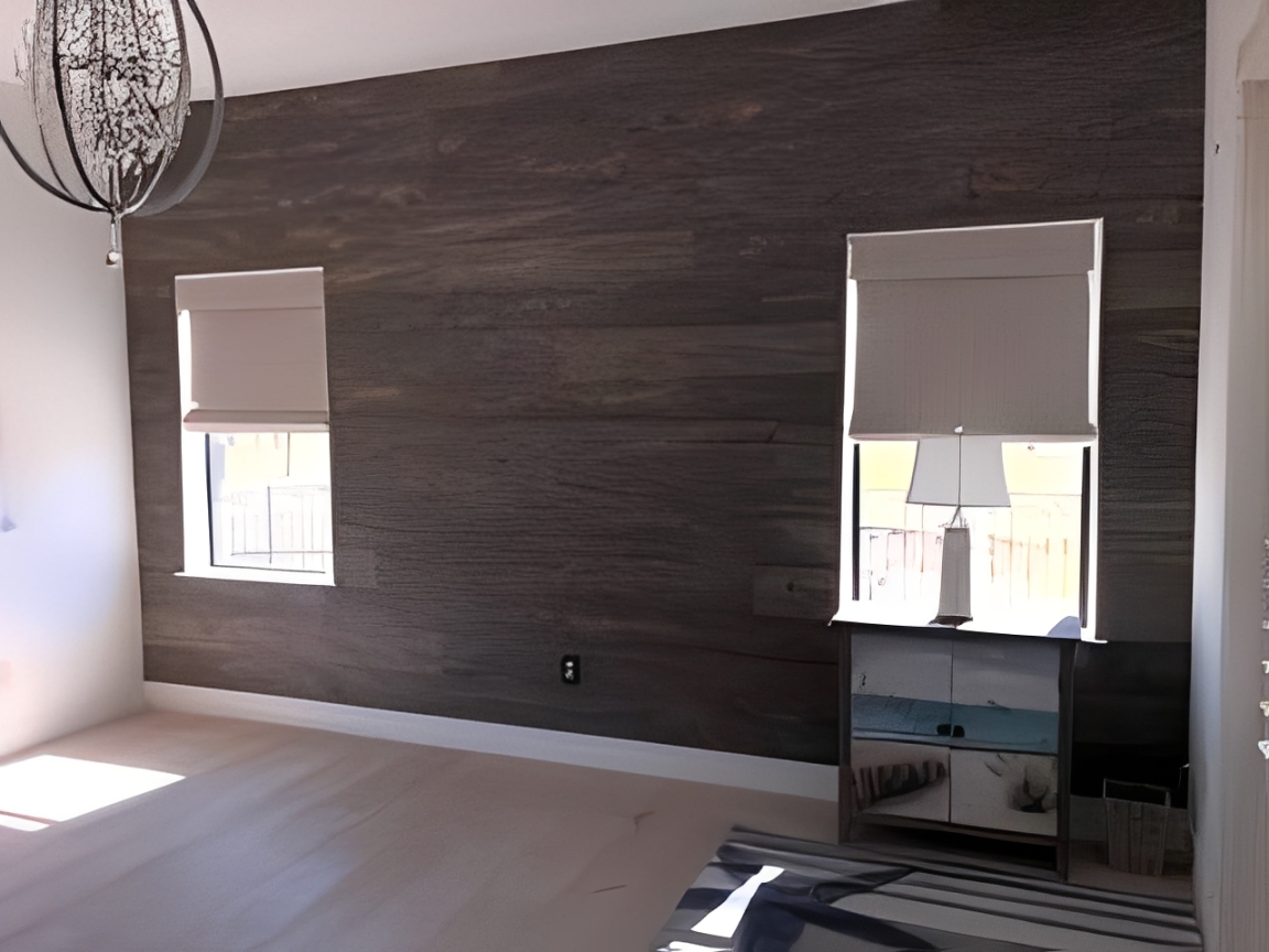 Minimalist room featuring a sleek chandelier
