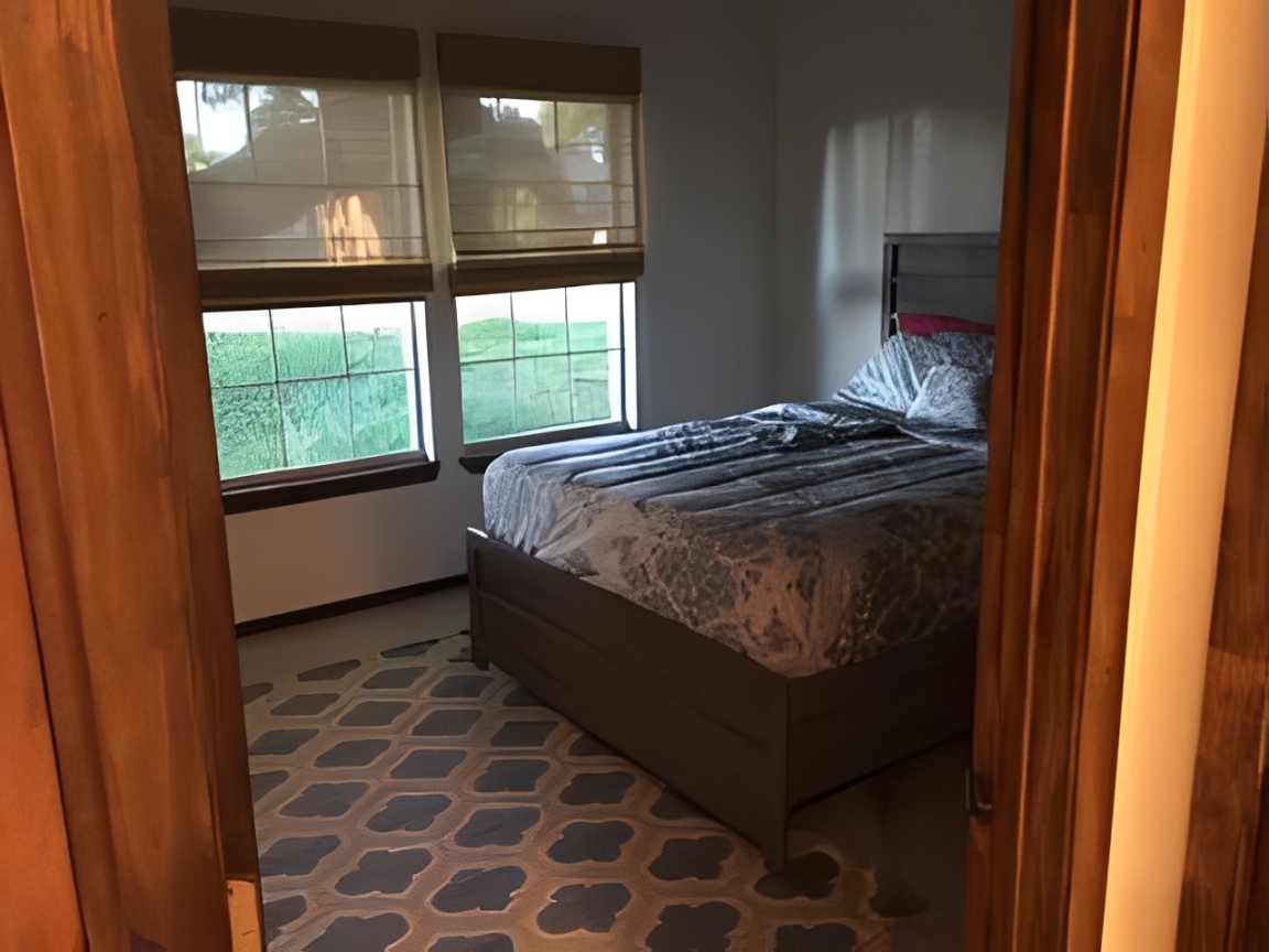Cozy bedroom with large window views