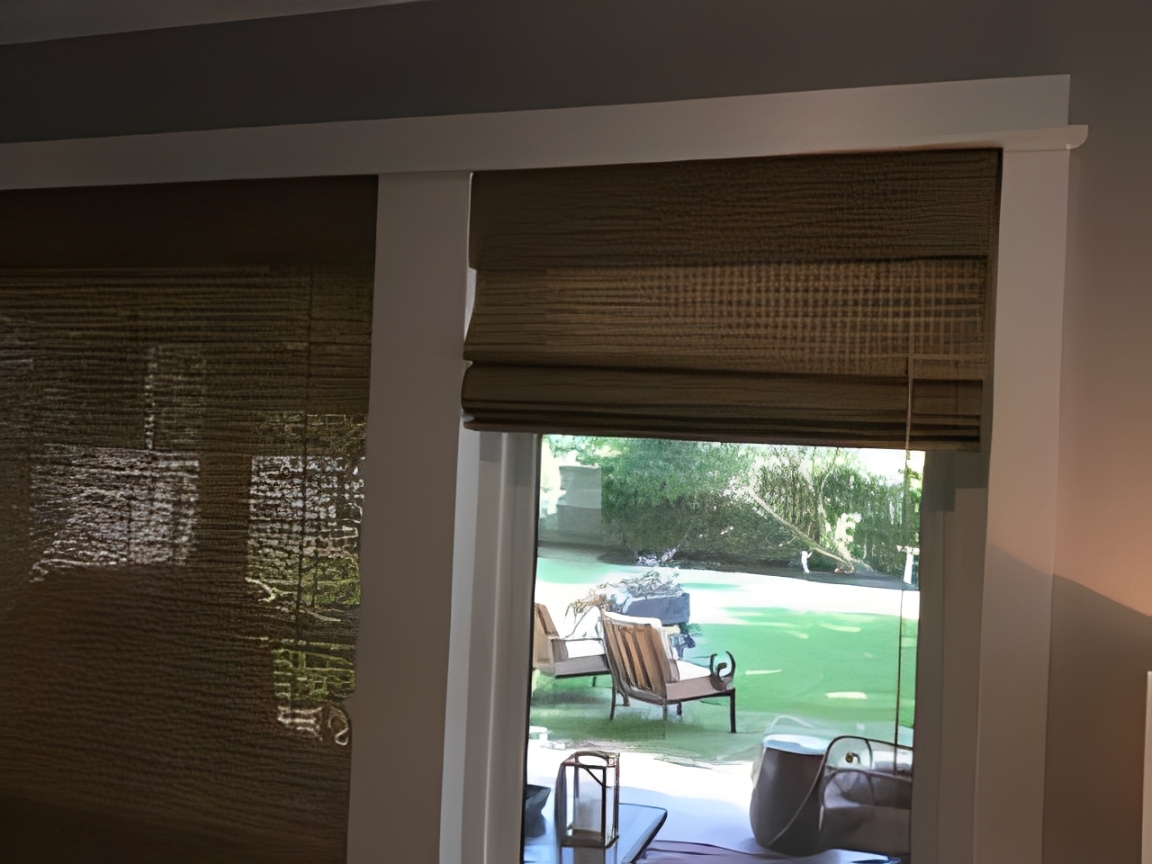 Window with bamboo blinds and outdoor view